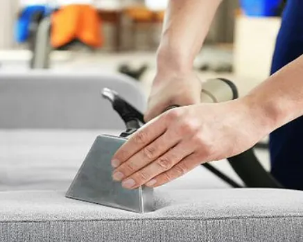Professional upholstery cleaning in progress